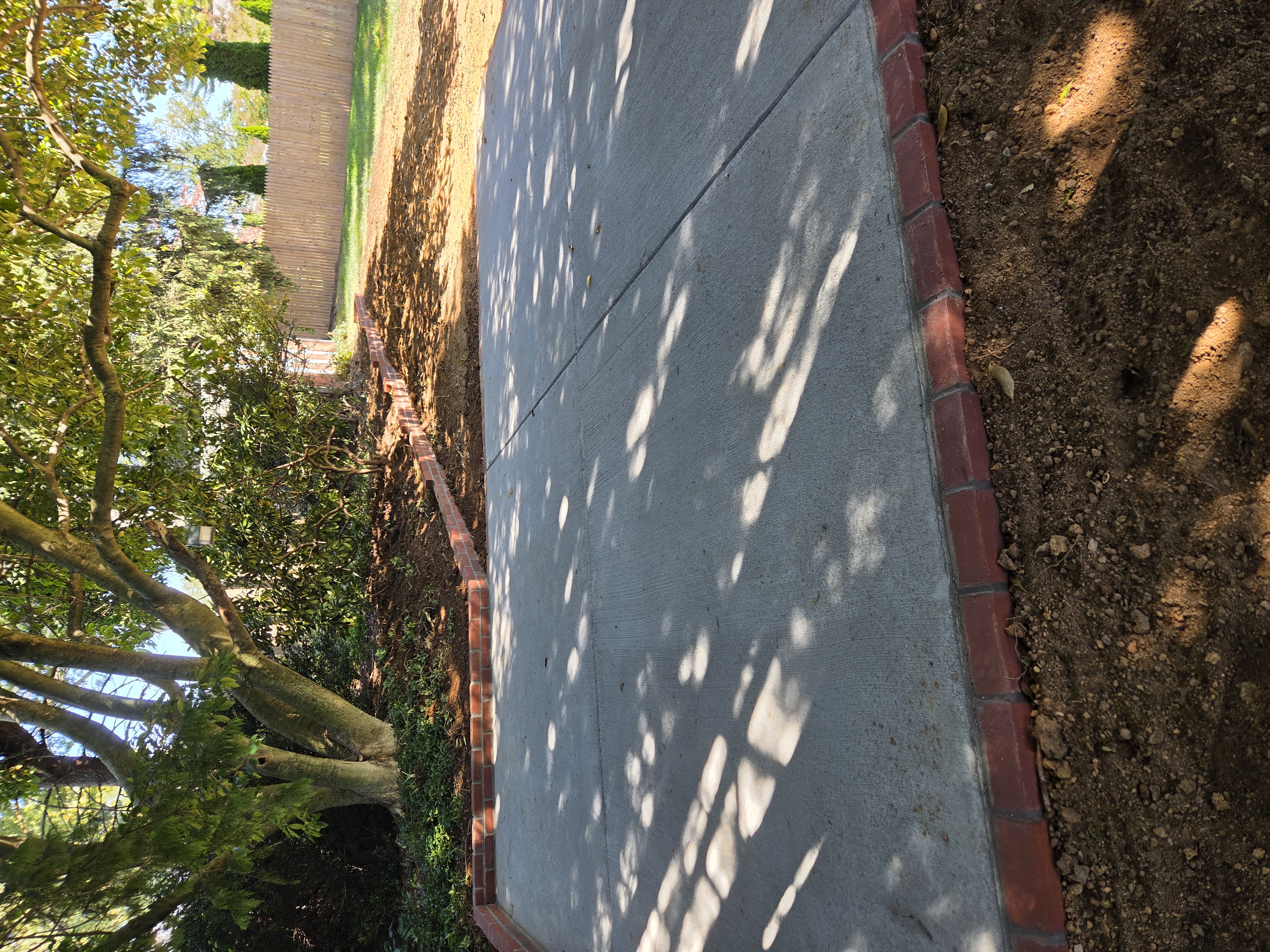 Completed concrete patio and brick border project in Paoli Pennsylvania