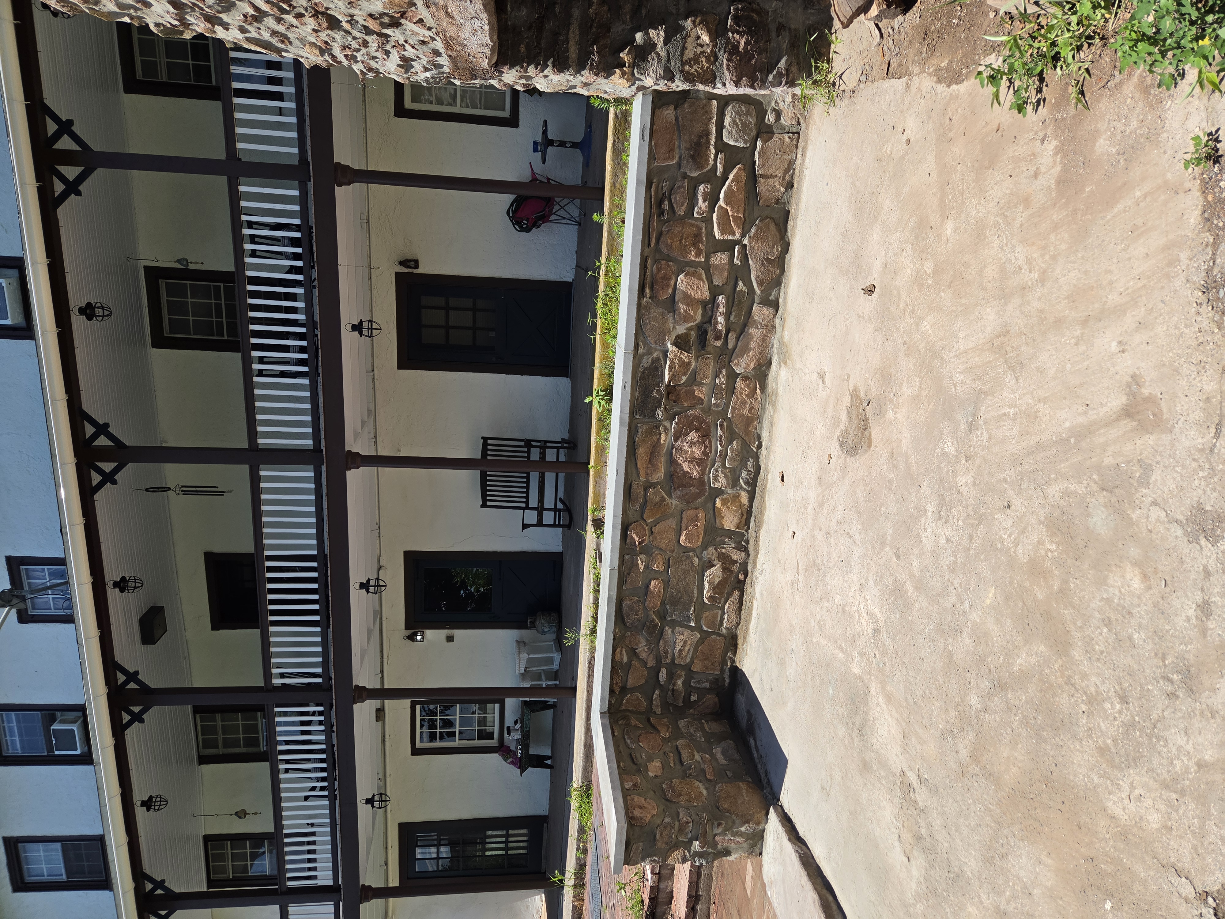 Completed natural stone sitting wall with cut stone cap at a historic Birdsboro Pennsylvania property