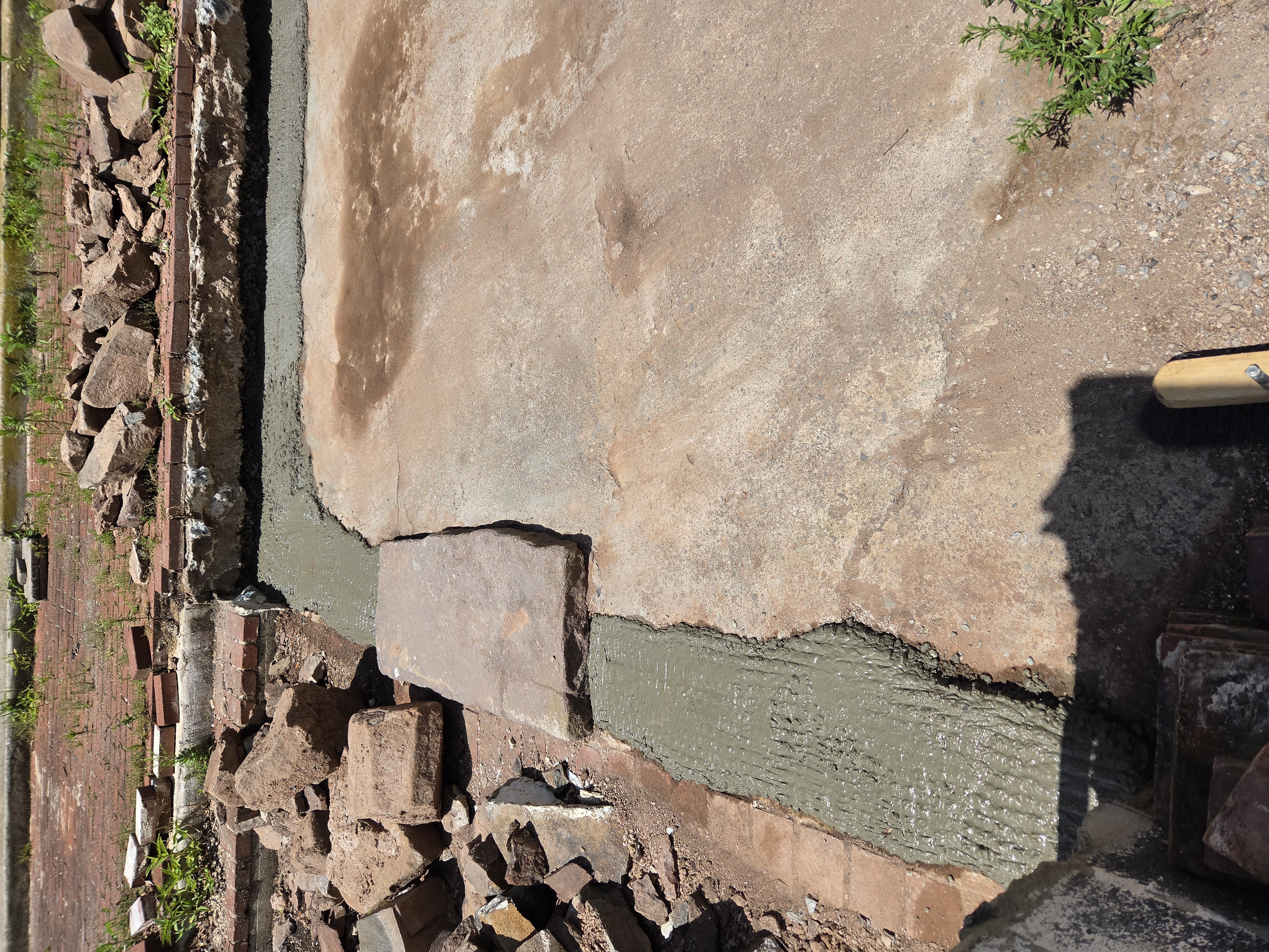 Concrete footings installed for a historic freestanding stone sitting wall in Birdsboro Pennsylvania