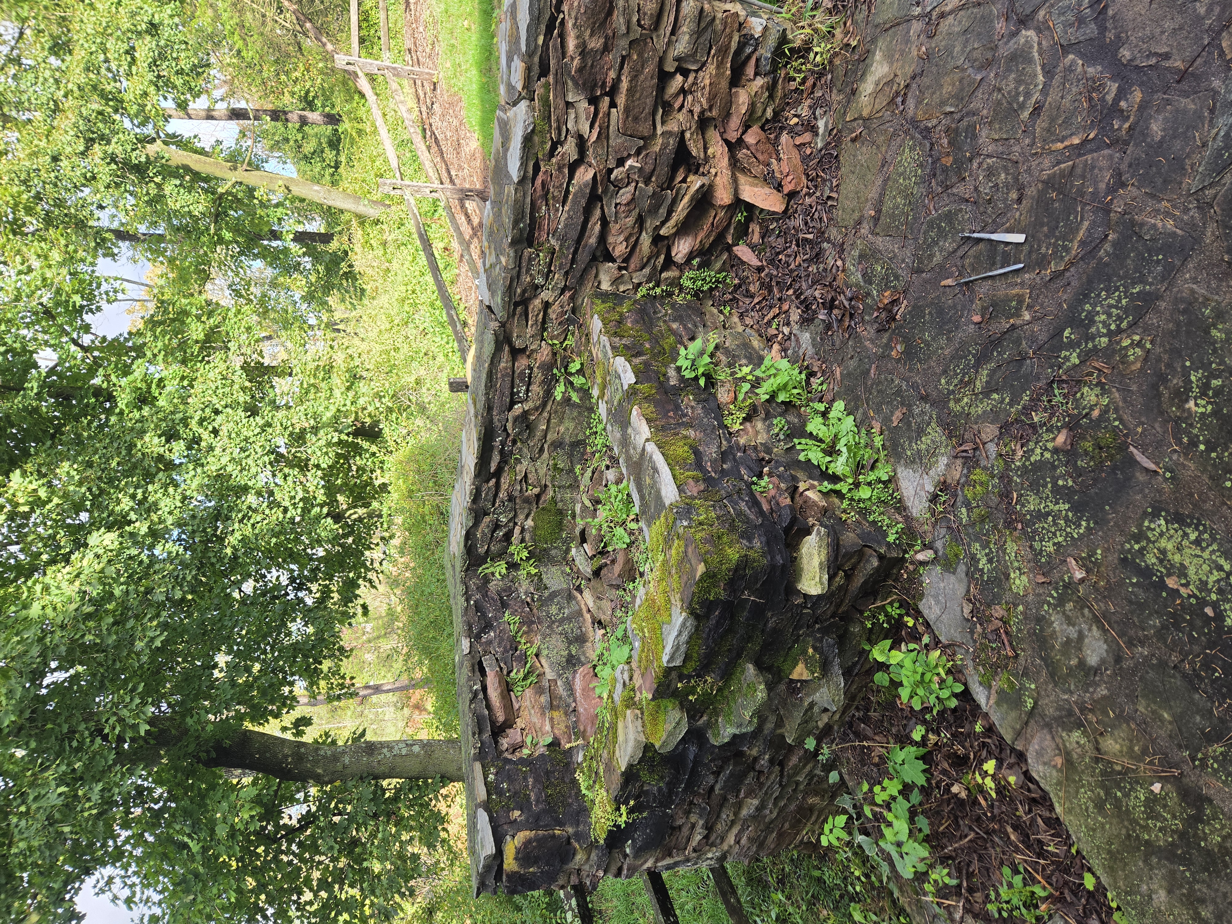Original stone waterfall with loose stones and failing mortar in Birdsboro PA