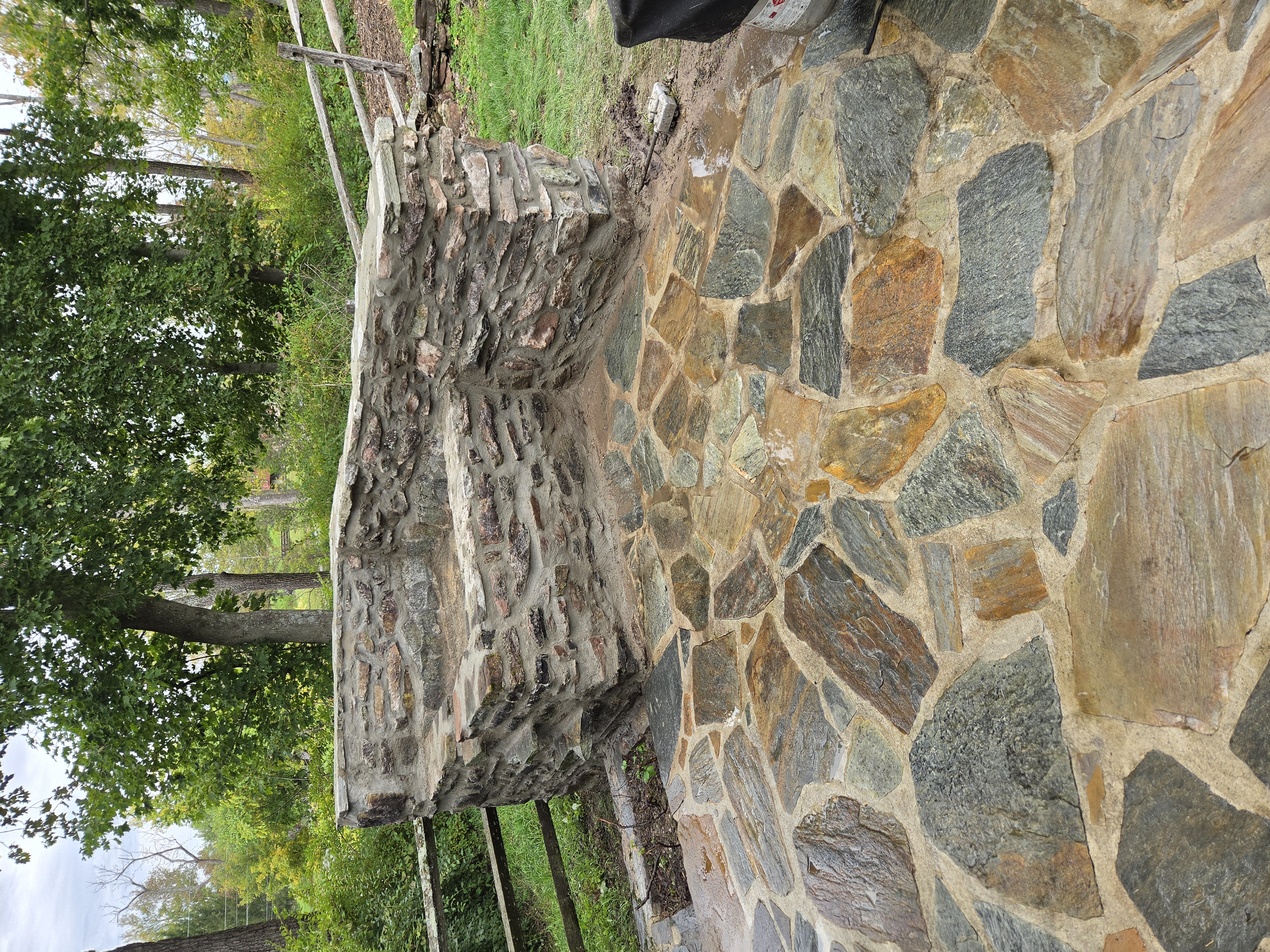 Restored historic stone waterfall and adjoining flagstone patio in Birdsboro PA