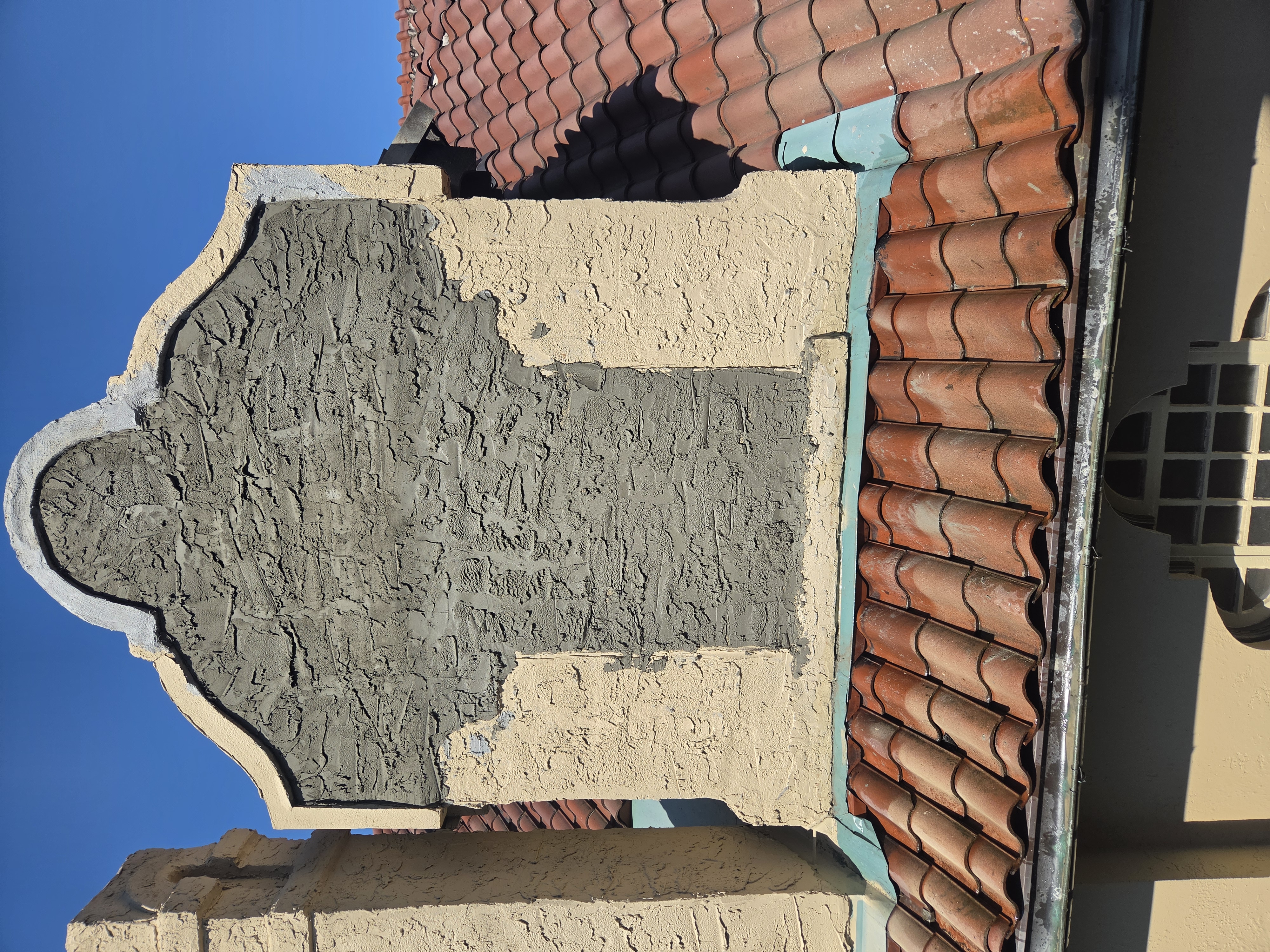 Scratch coat and texture work during stucco repair in Pottstown Pennsylvania